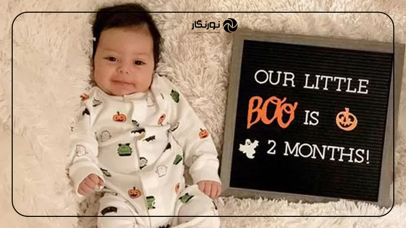 عکس نوزاد با تابلو