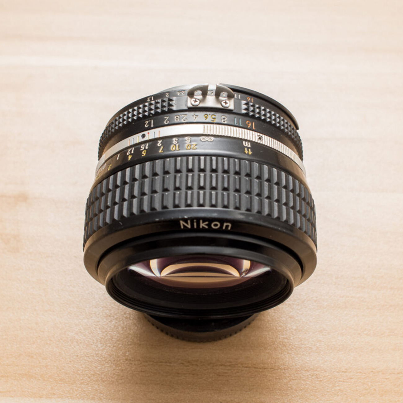 عکس از بالا لنز نیکون Nikon Nikkor 50mm f/1.2 AiS Camera Lens
